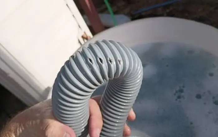how to unclog a curved vacuum hose